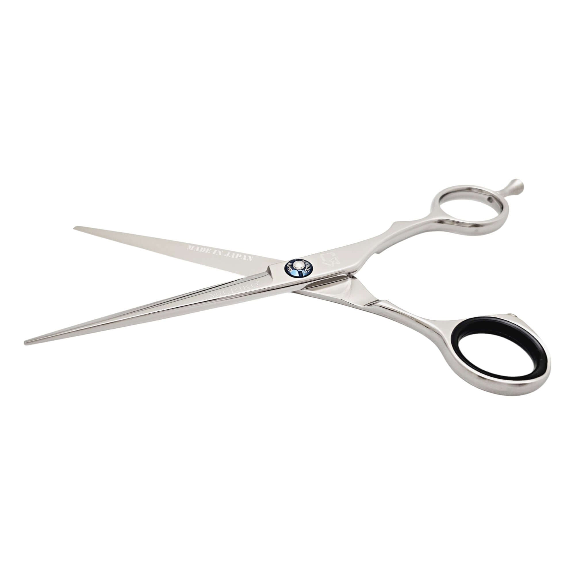 Hair cutting scissors with a blue screw on a white background
