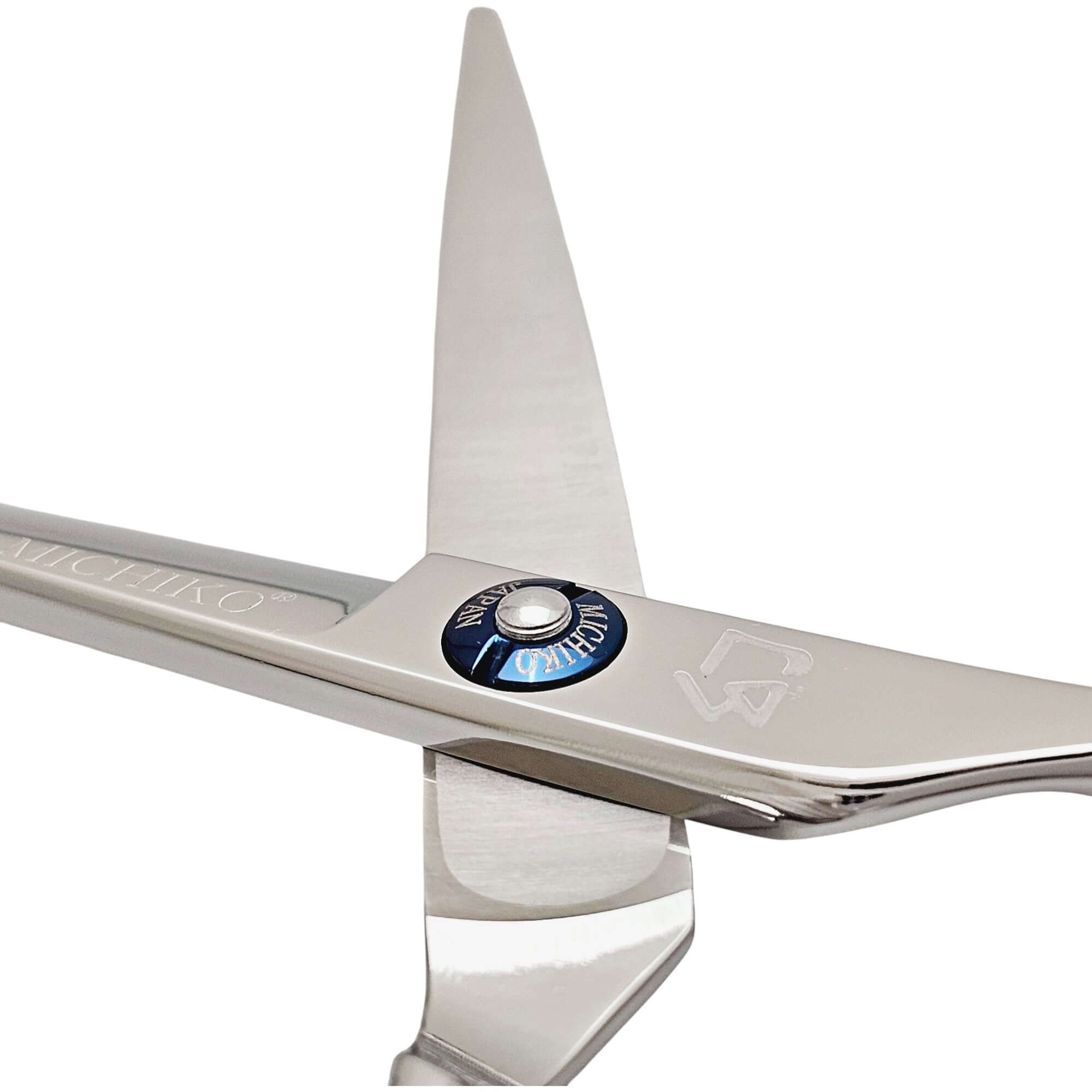 Close-up of a pair of scissors with a visible brand logo on a white background