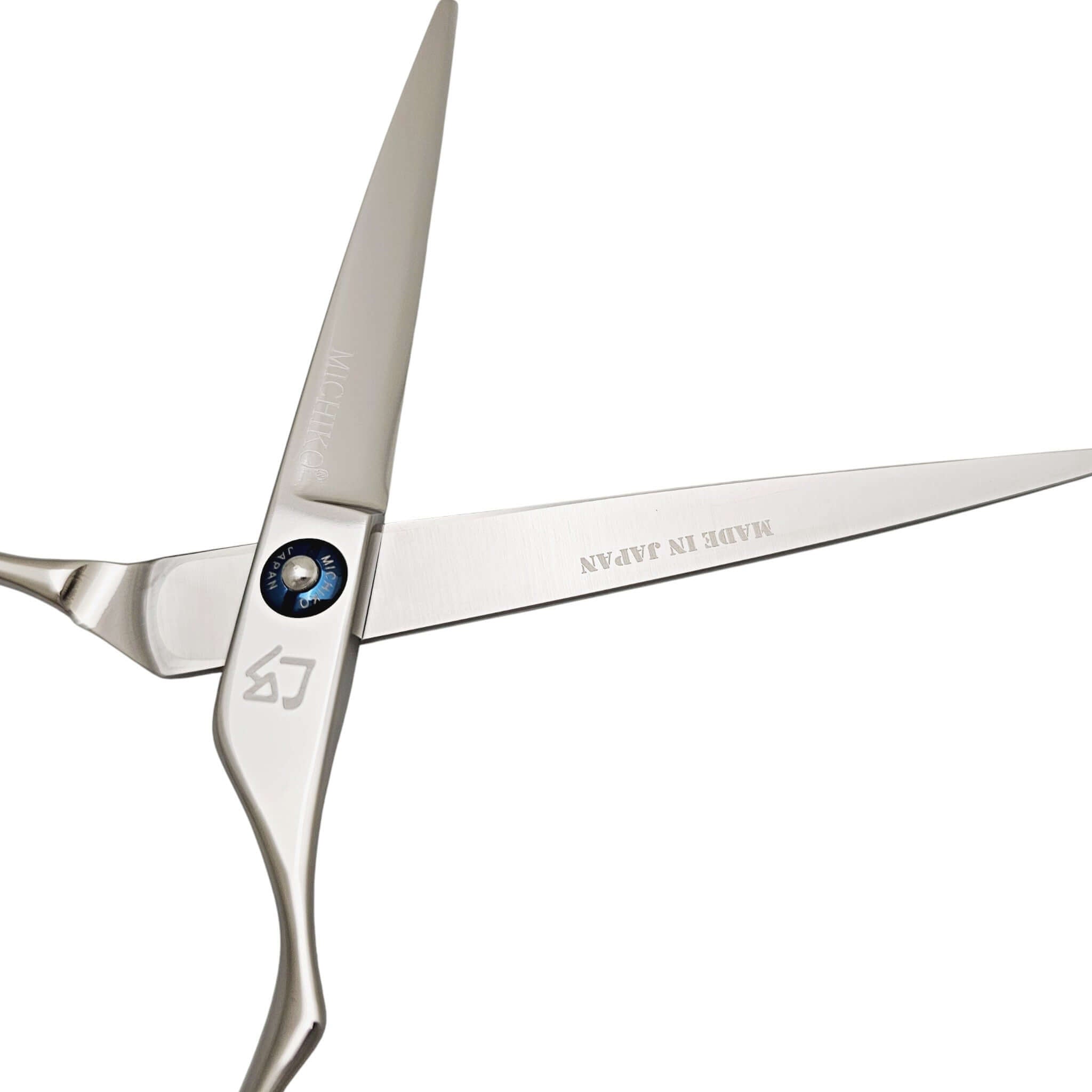 Silver scissors with 'Made in Japan' branding on a white background