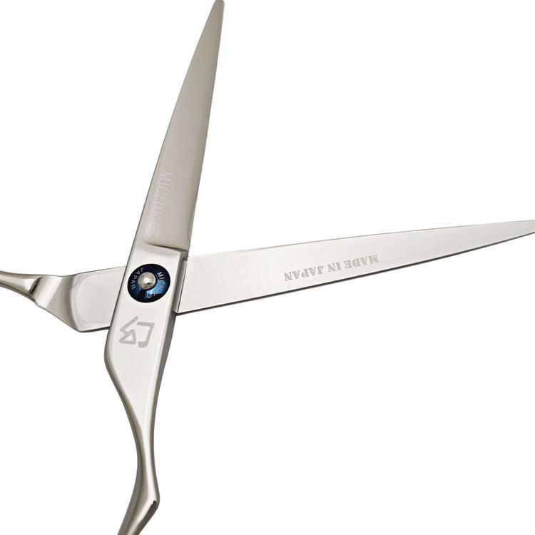 Silver scissors with 'Made in Japan' branding on a white background