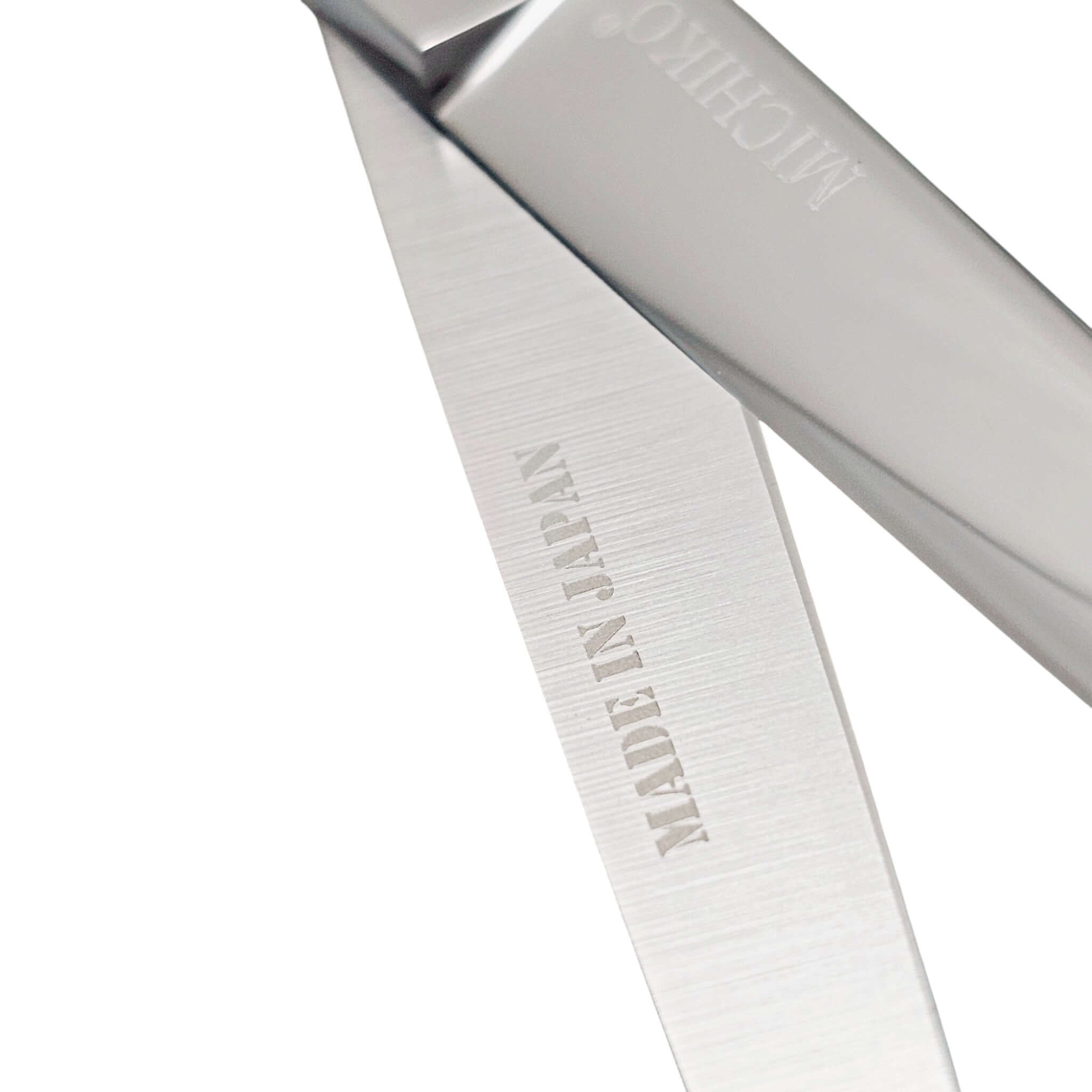 Professional Japanese Barber Shears with engraved 'Made in Japan' on the cutting blade.