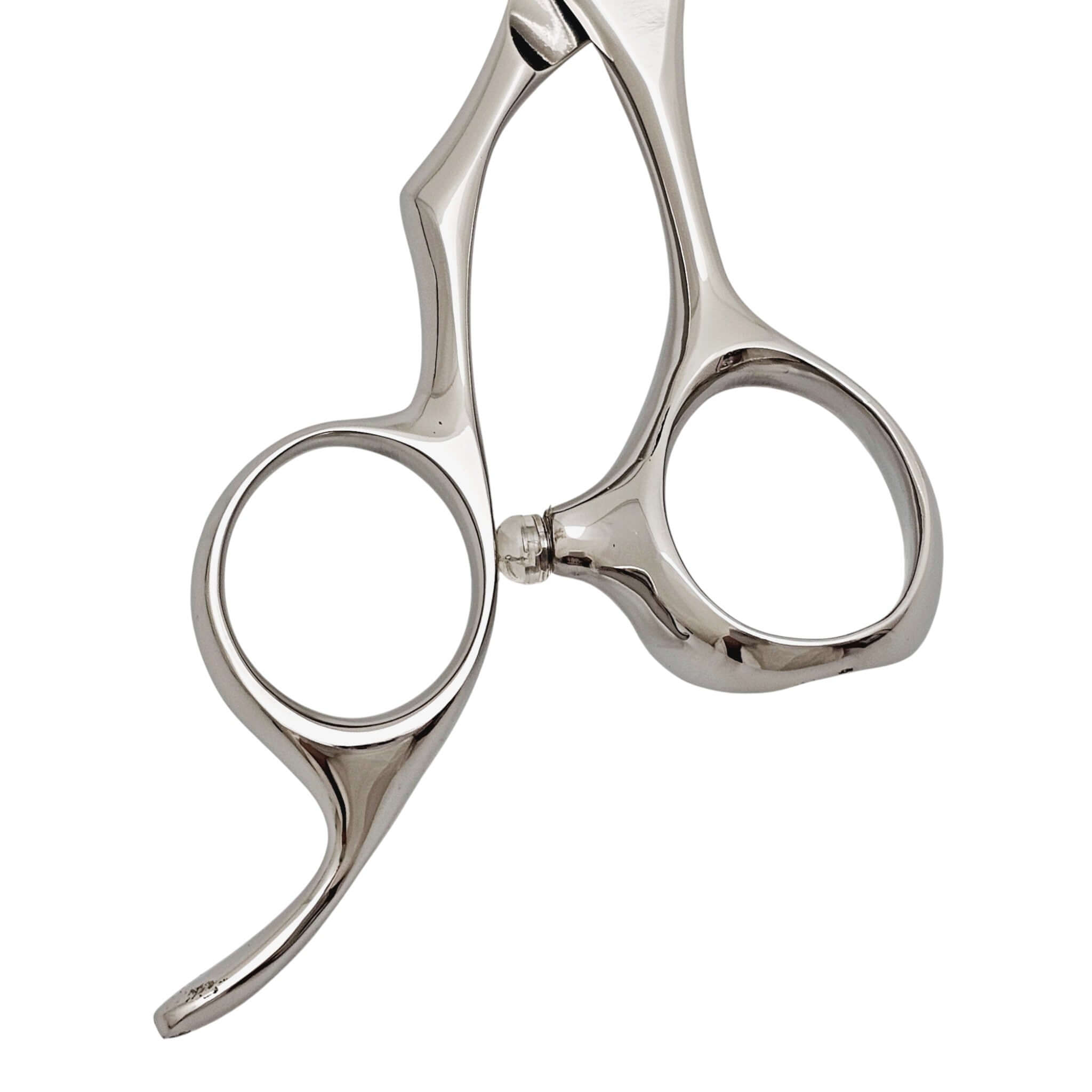Close-up of a pair of silver hair scissors handle part on a white background