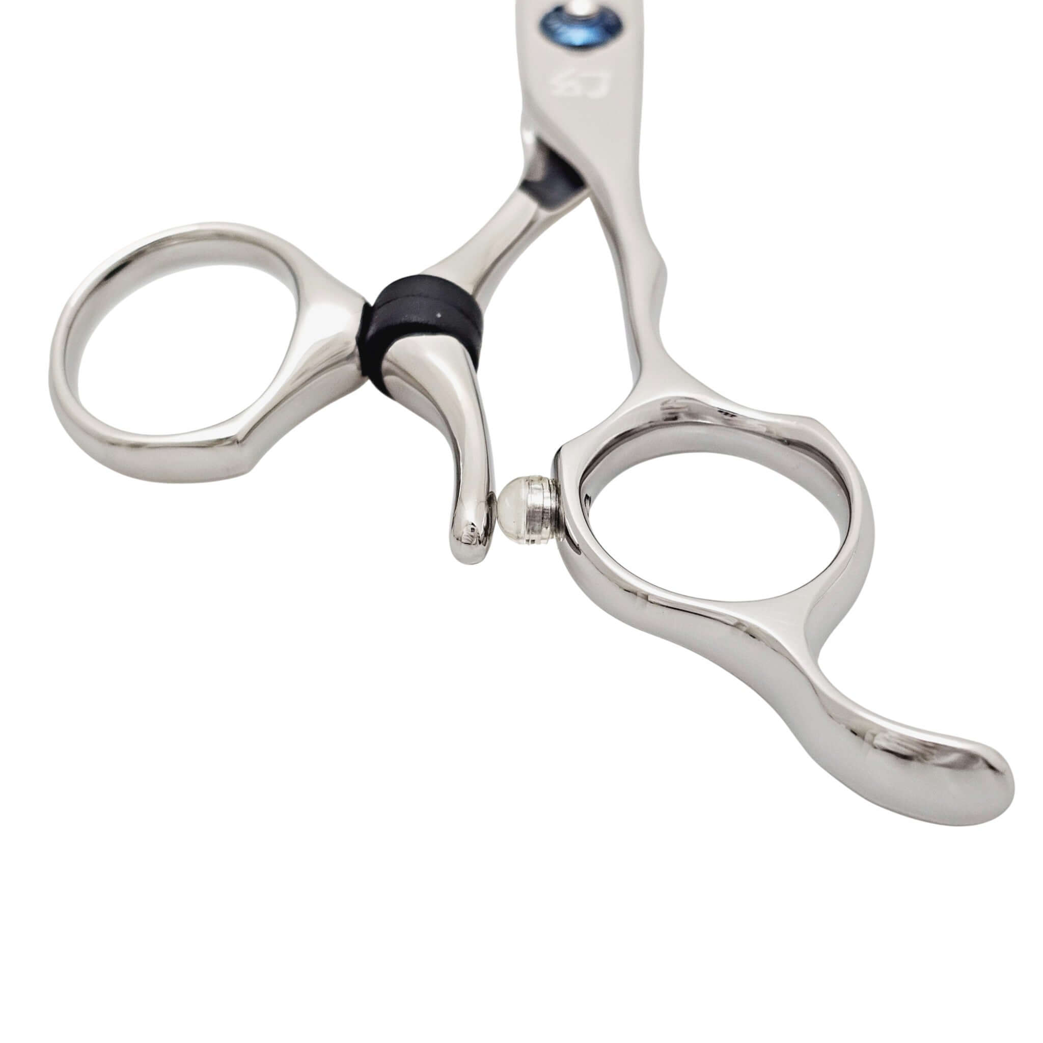 Close-up of a pair of silver swivel hair scissors on a white background