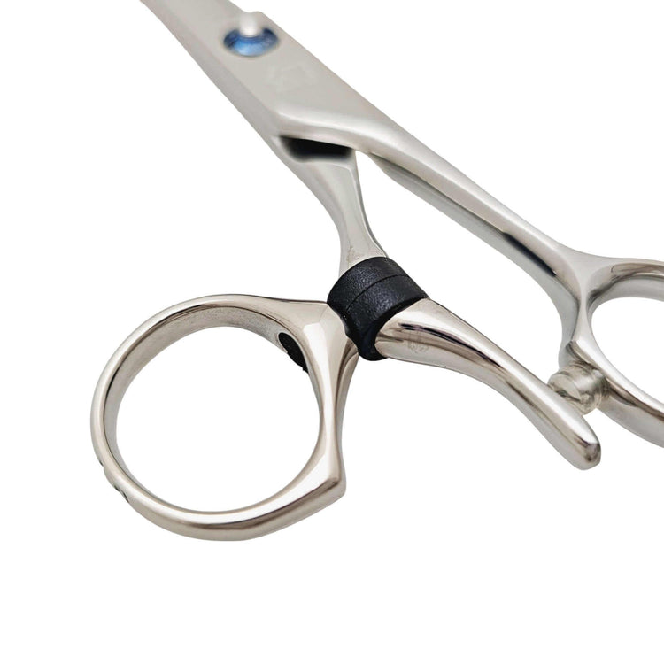 Close-up of a pair of swivel hair scissors on a white background