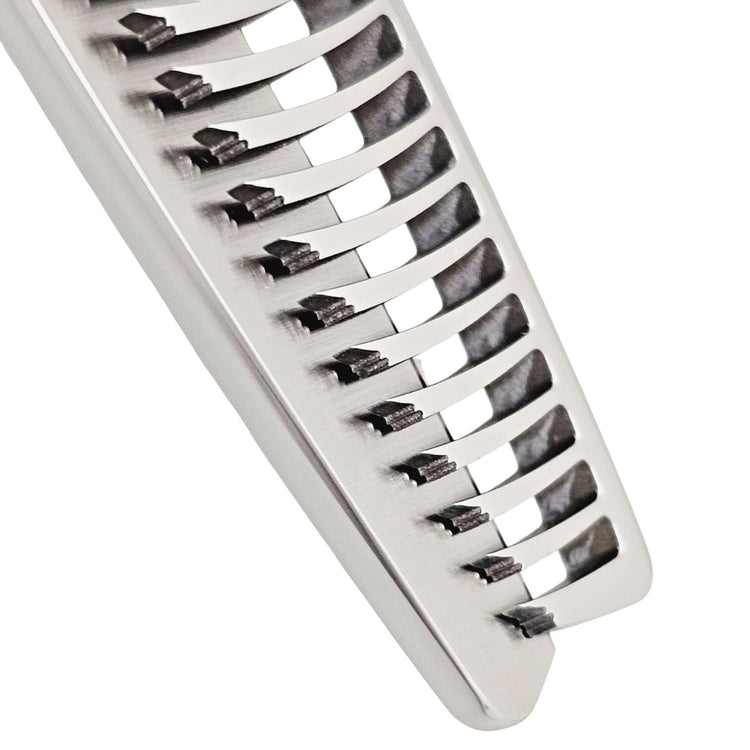Close-up of hair thinning blade on a white background
