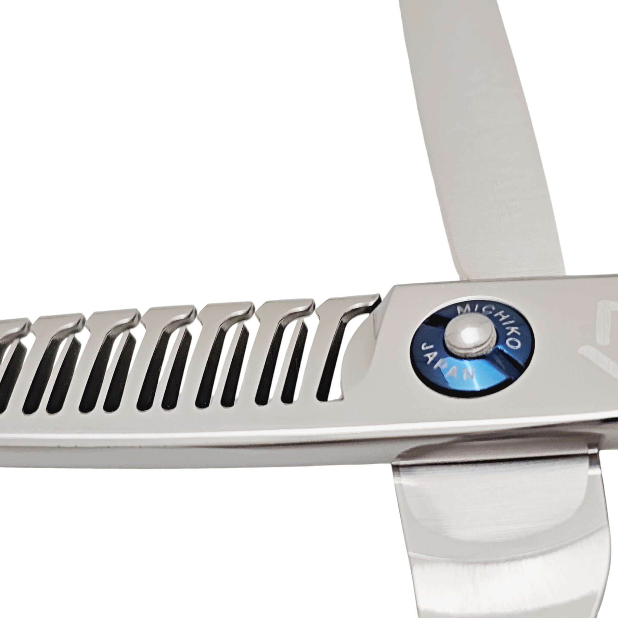 Close-up of a pair of silver hair scissors with 'Michiko Japan' branding on a white background