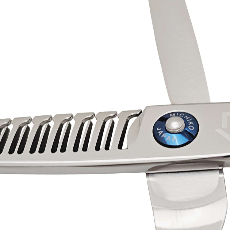 Close-up of a pair of silver hair scissors with 'Michiko Japan' branding on a white background