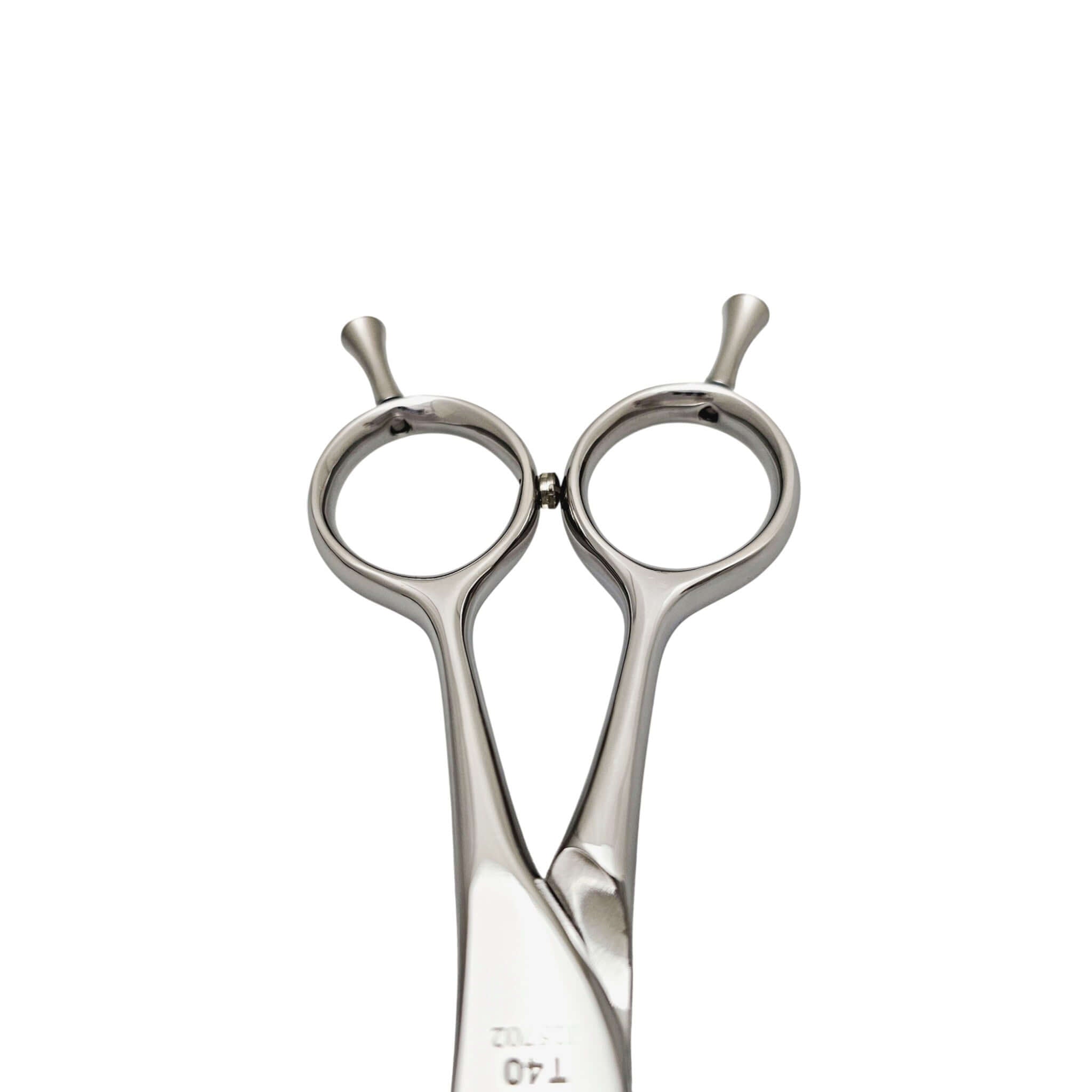 Hairdressing scissors handle on a white background