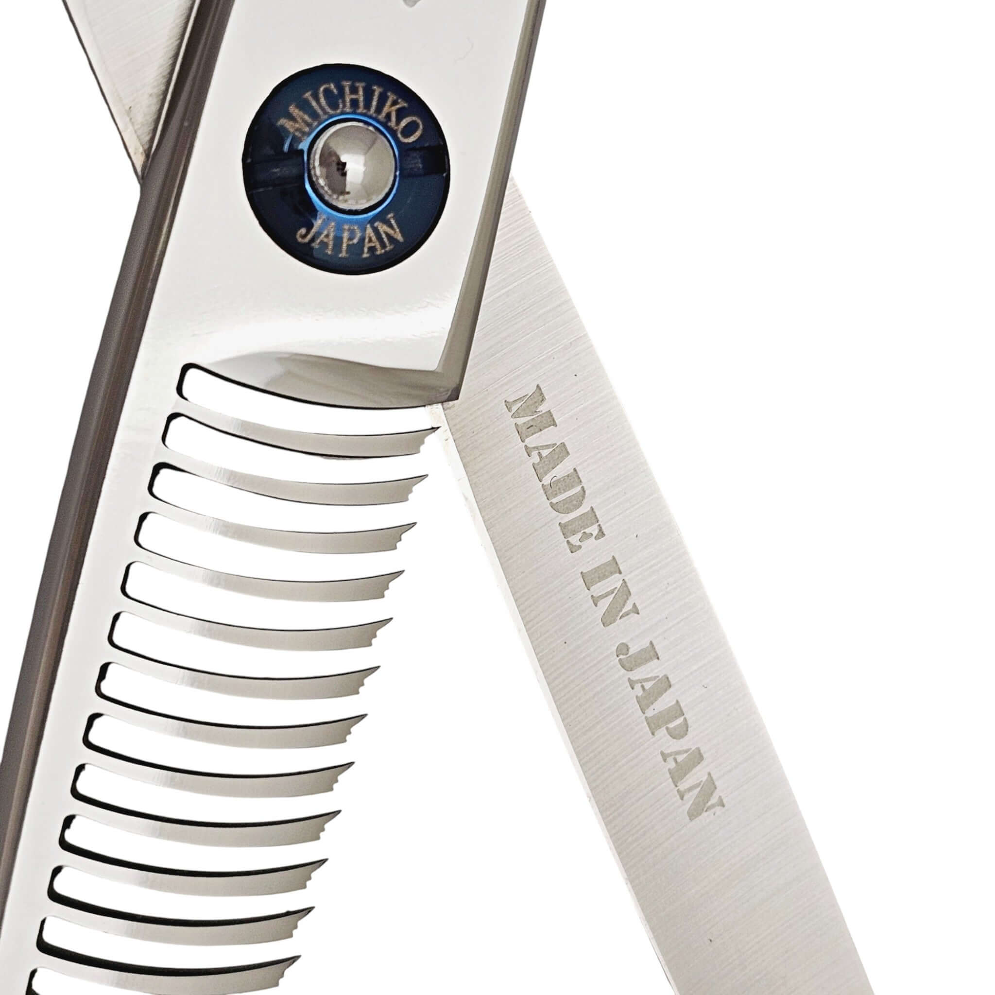 Close-up of a pair of hair scissors with 'Michiko Japan' branding on a white background