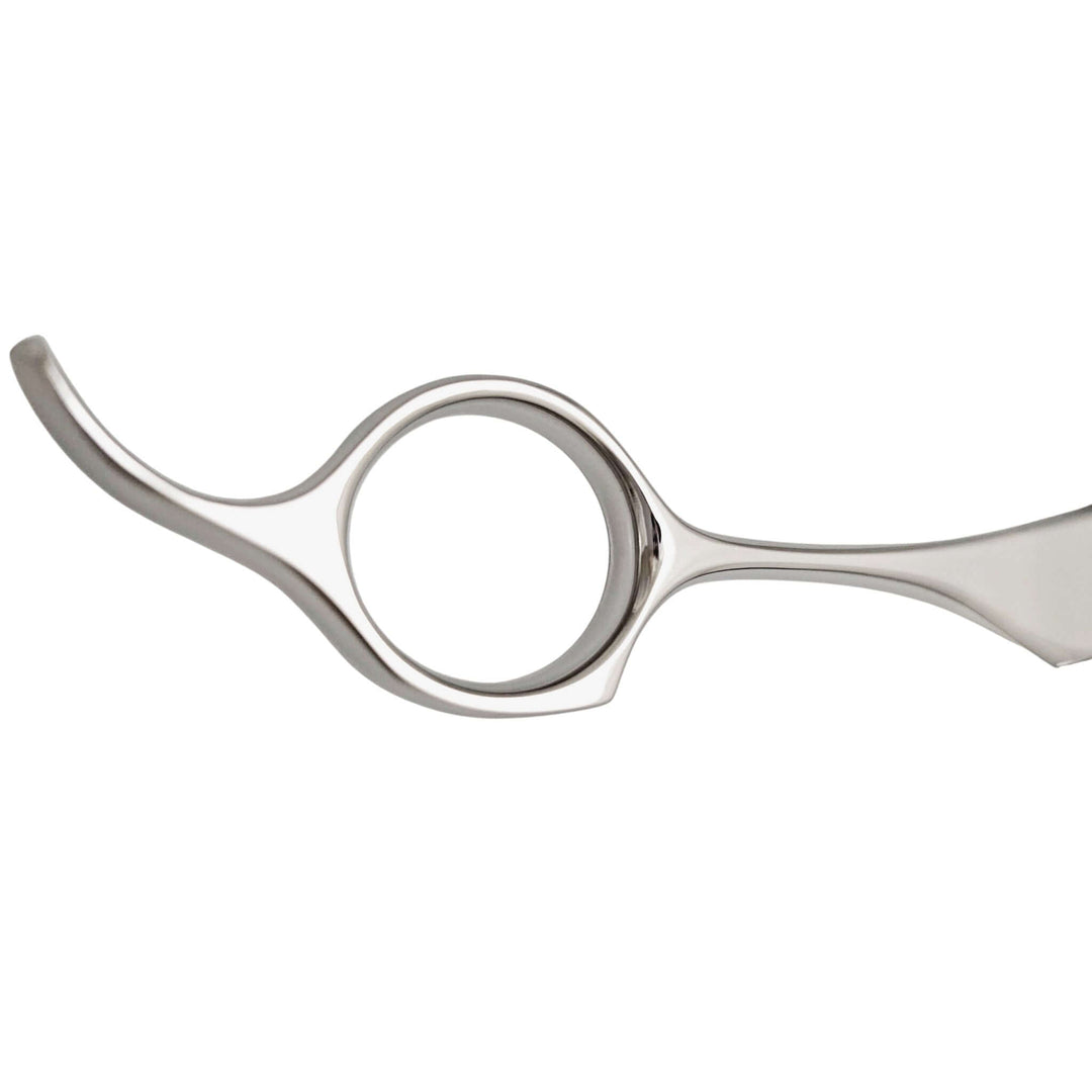 Metallic hairdressing shears on a white background
