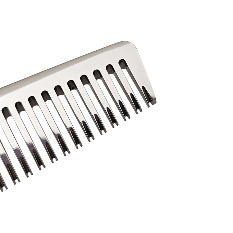 Metal teeth from the barber thinning shears on a white background