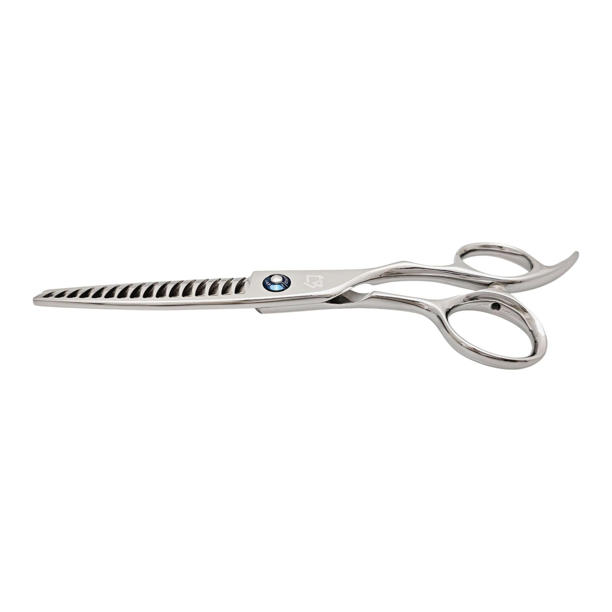 Stainless steel hair thinning scissors on a white background