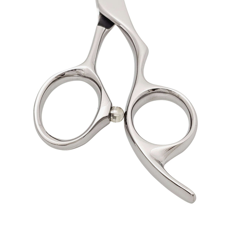 Close-up of a pair of hair scissors on a white background