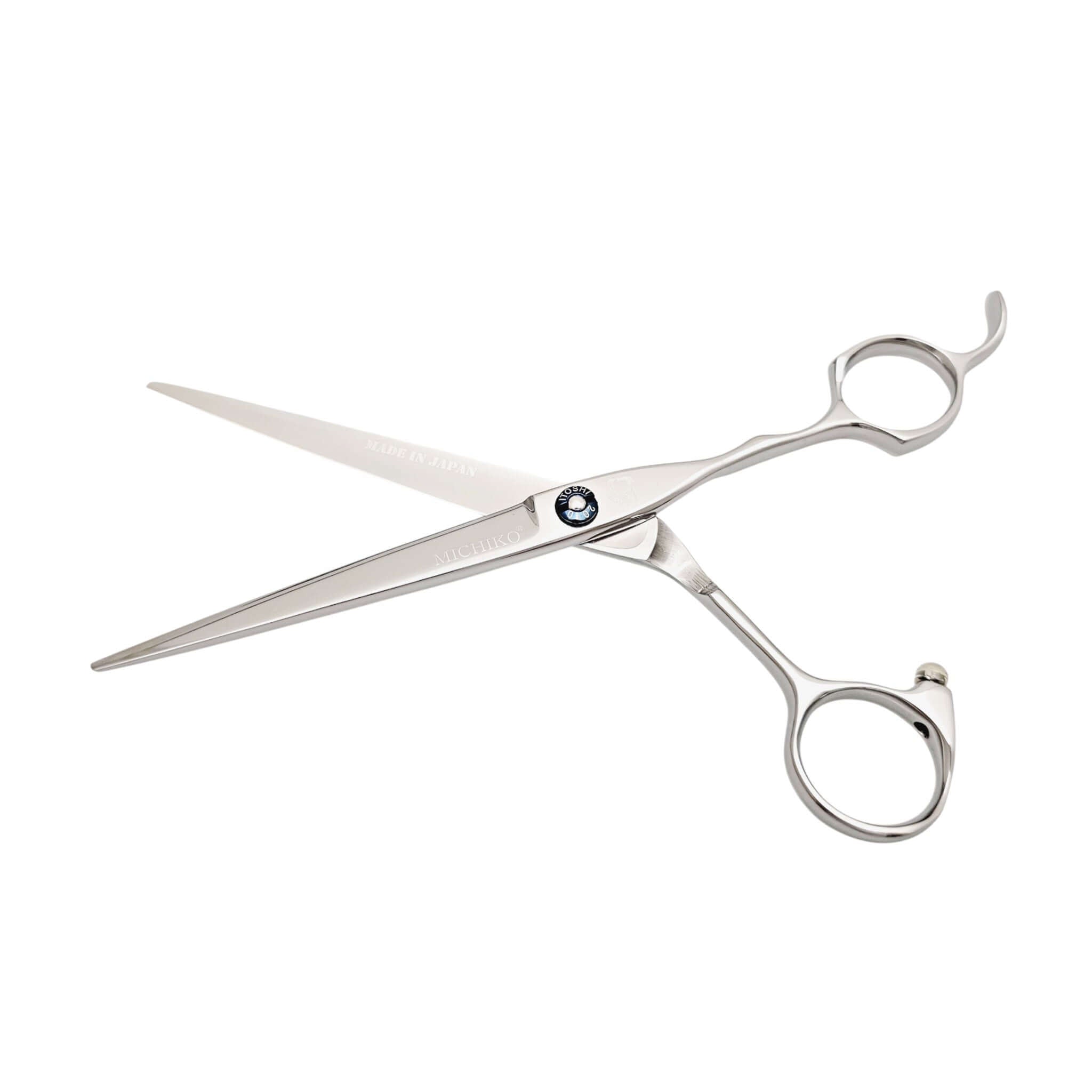 Silver hair scissors on a white background