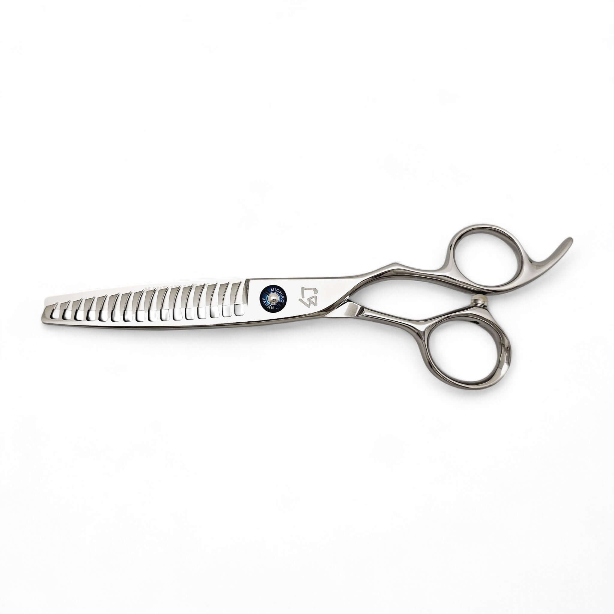Stainless steel hair thinning scissors on a white background