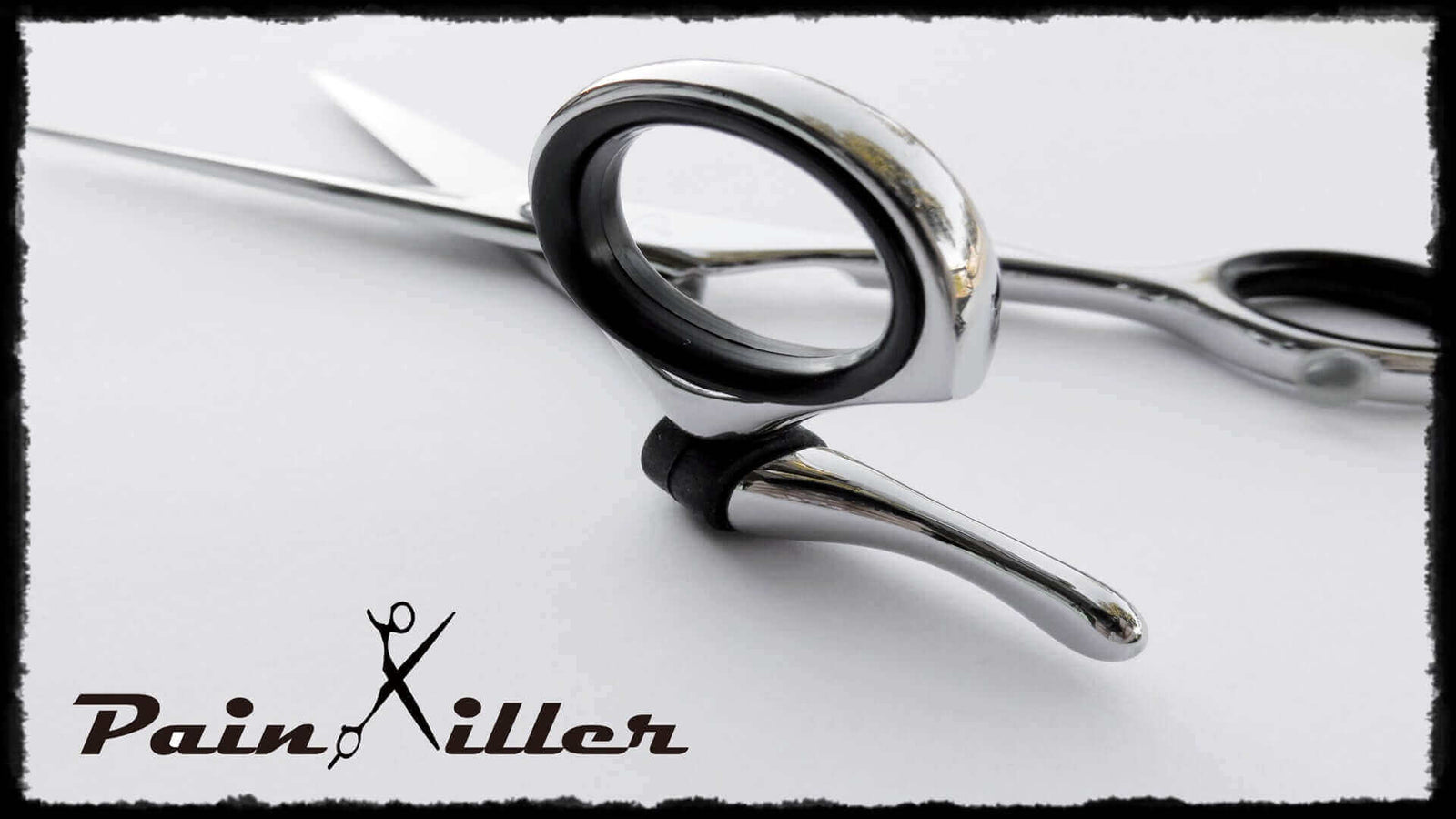 Painkiller Swivel Shears featuring ergonomic design and 360-degree rotating thumb ring – professional hair cutting scissors for hairstylists seeking precision, comfort, and reduced wrist strain.