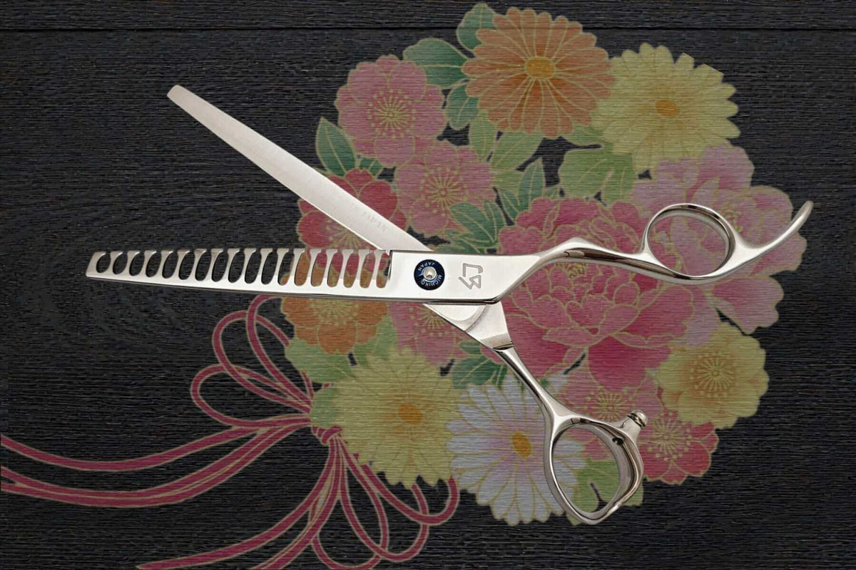 Japanese scissors placed on a floral background, showcasing their design and craftsmanship. Why Do Japanese Scissors Still Hold Value.