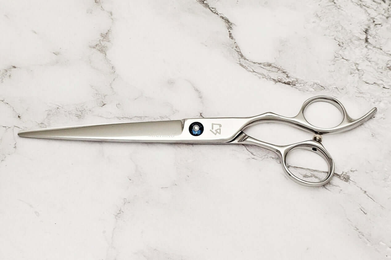 Cobalt alloy 7.5" barber shears on a marble surface