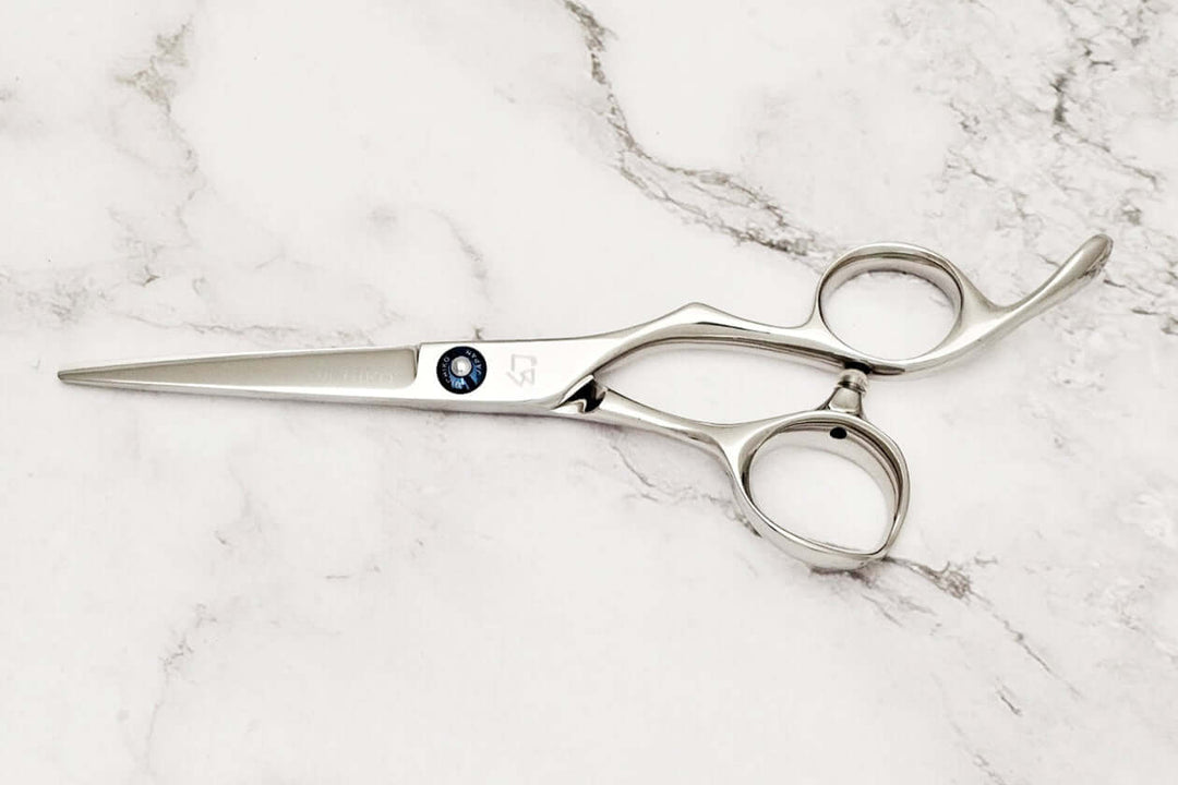 Barber shears on a marble surface