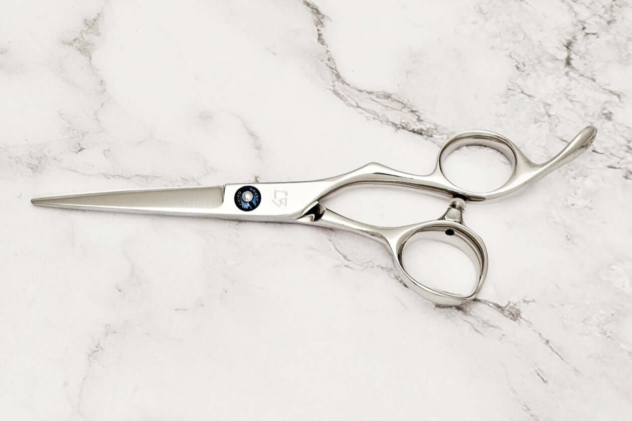 Barber shears on a marble surface