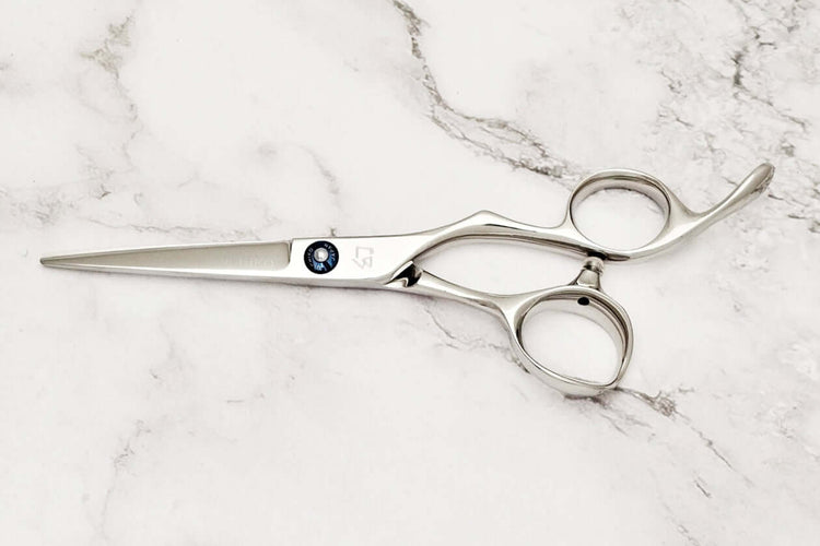 Barber shears on a marble surface