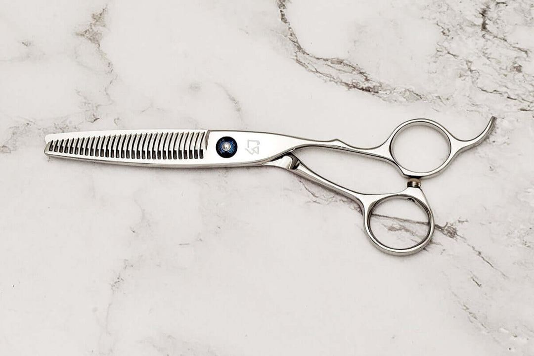 Crane handle hair thinner on a marble surface