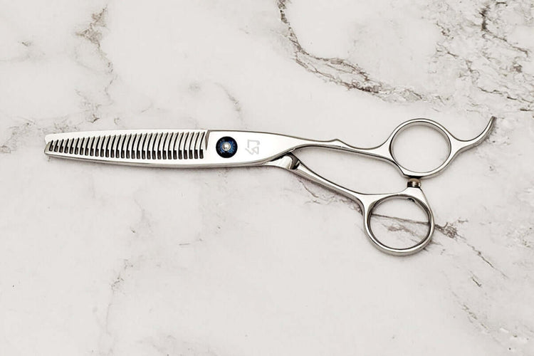 Crane handle hair thinner on a marble surface