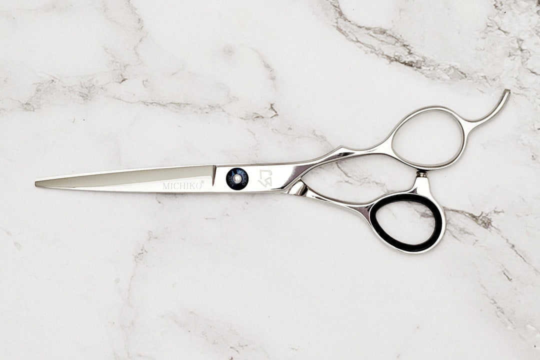Hair scissors on a marble surface