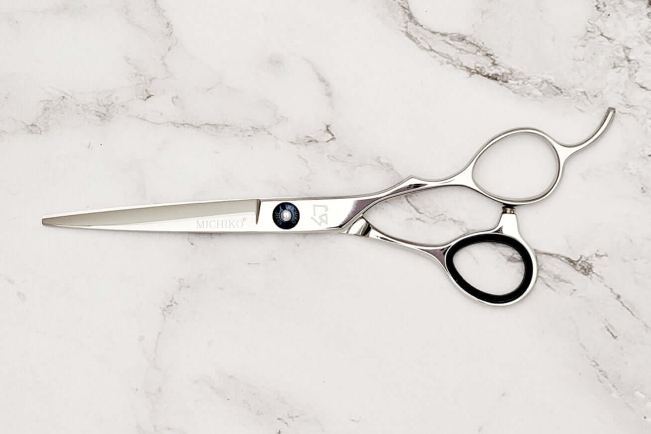 Hair scissors on a marble surface