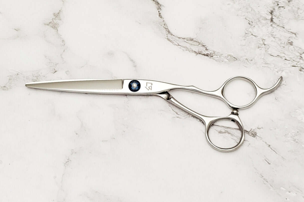 Hair scissors on a marble surface