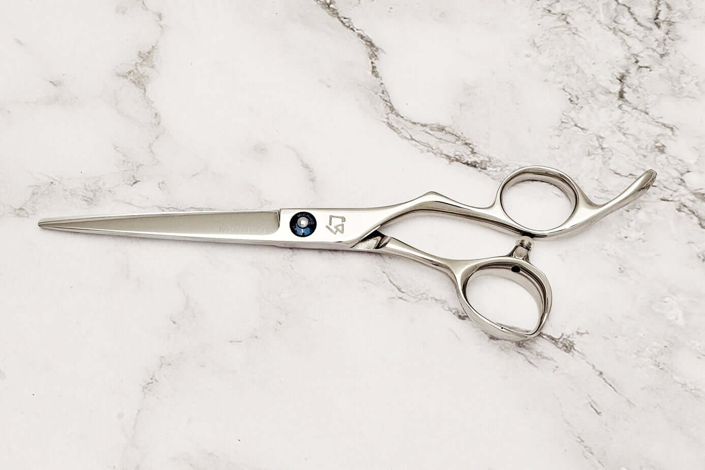 Barber shears on a marble surface