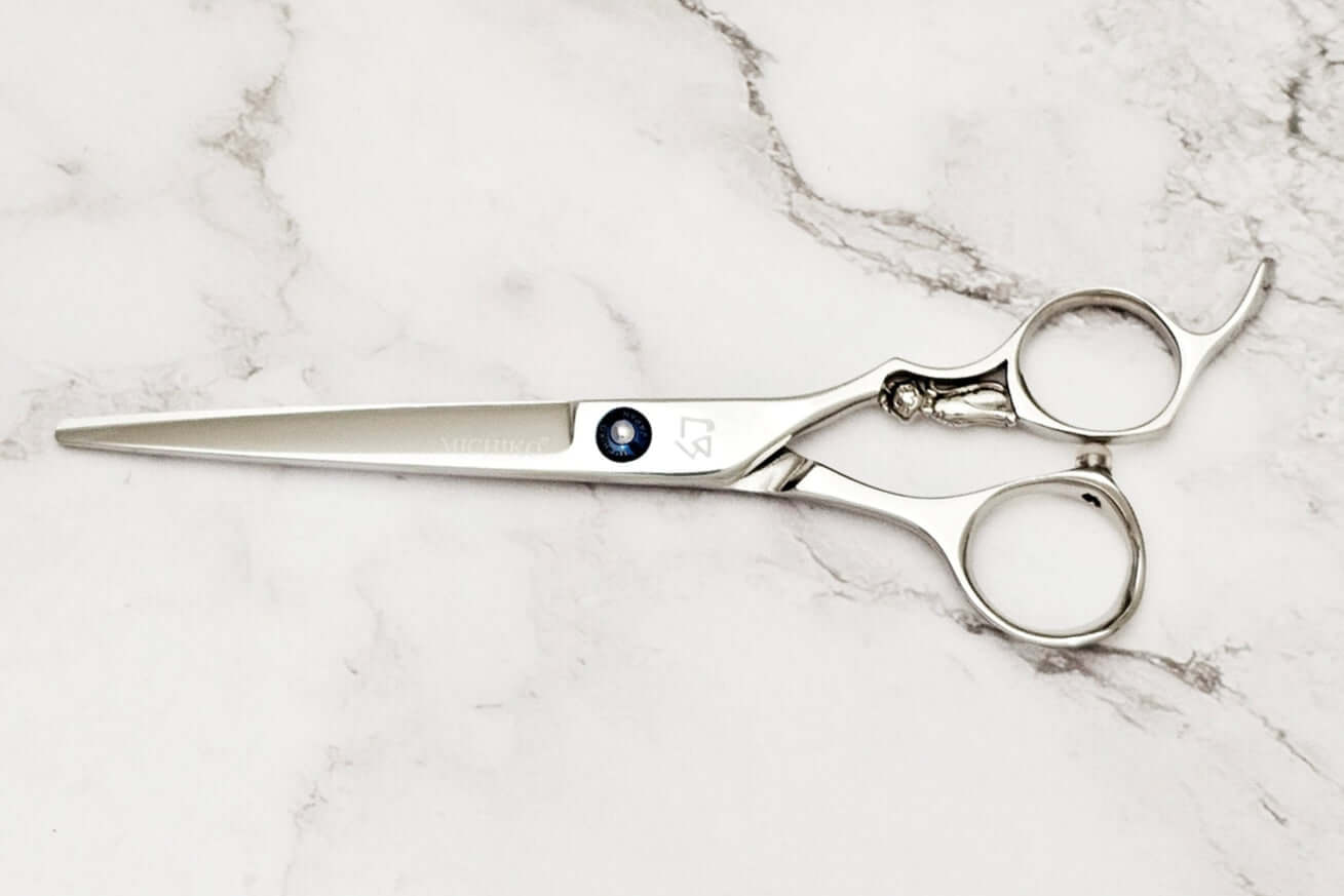 Cat Handle Hair Cutting Scissors on a marble surface