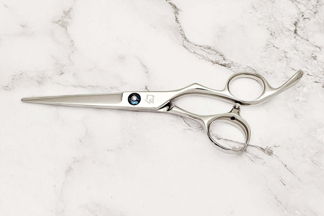 Barber shears on a marble surface