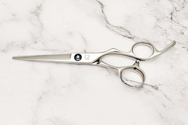 Barber shears on a marble surface