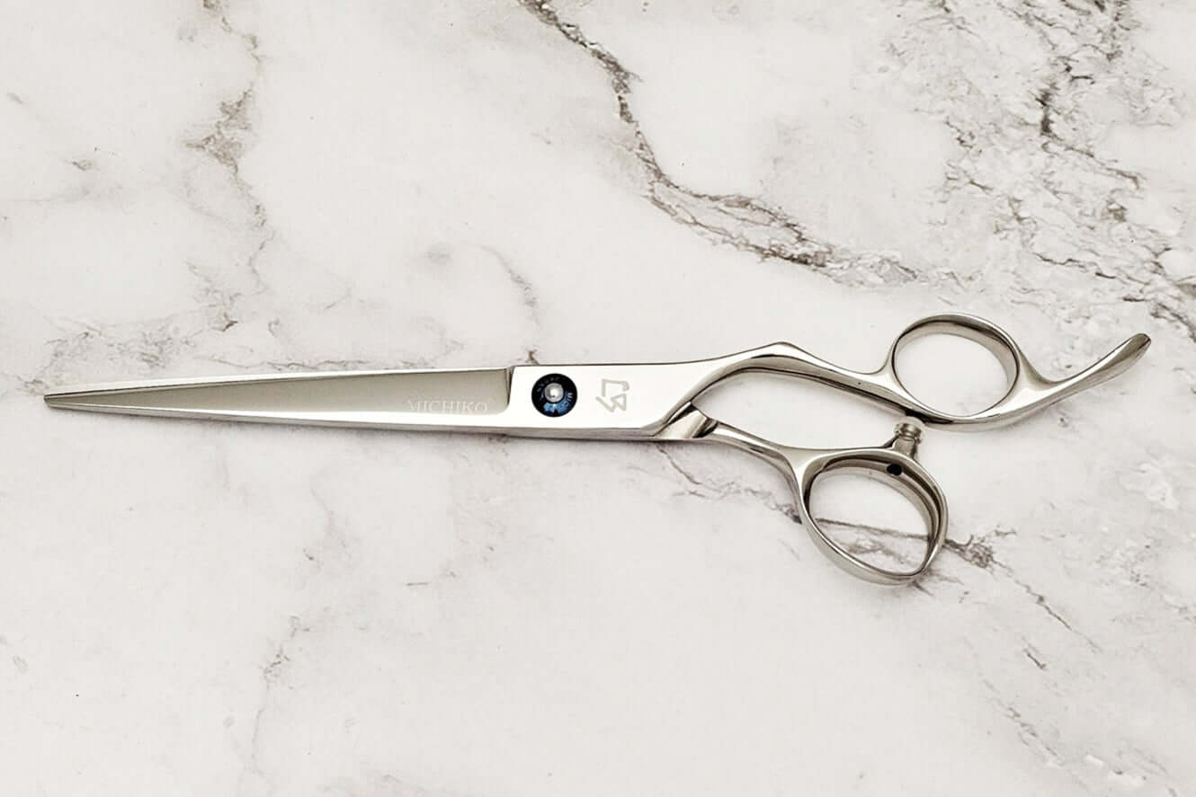 Barber shear KM 7.0 on a marble surface