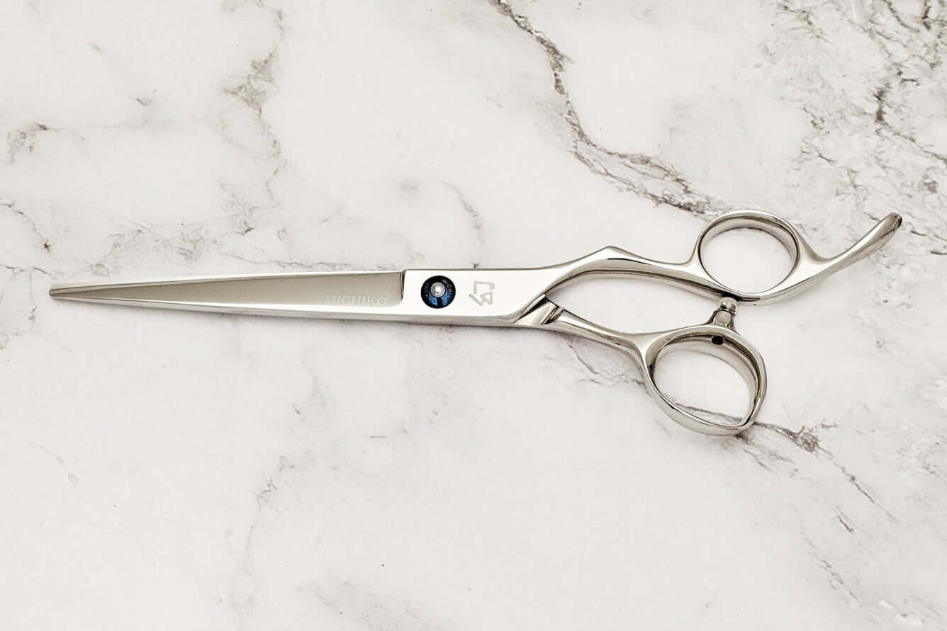 Barber shears on a marble surface