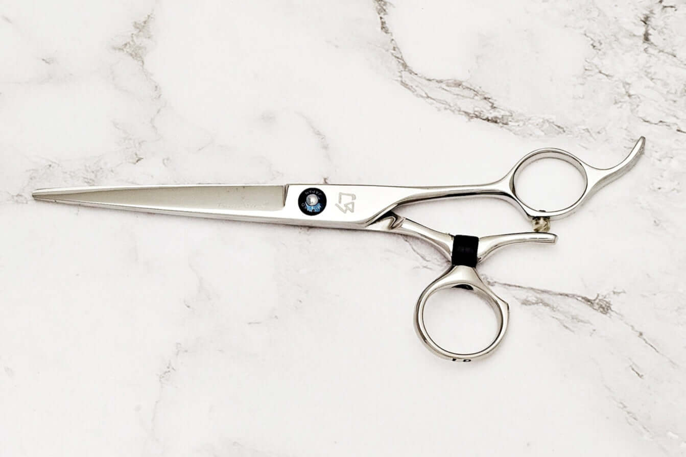 Swivel hair cutting scissors on a white background