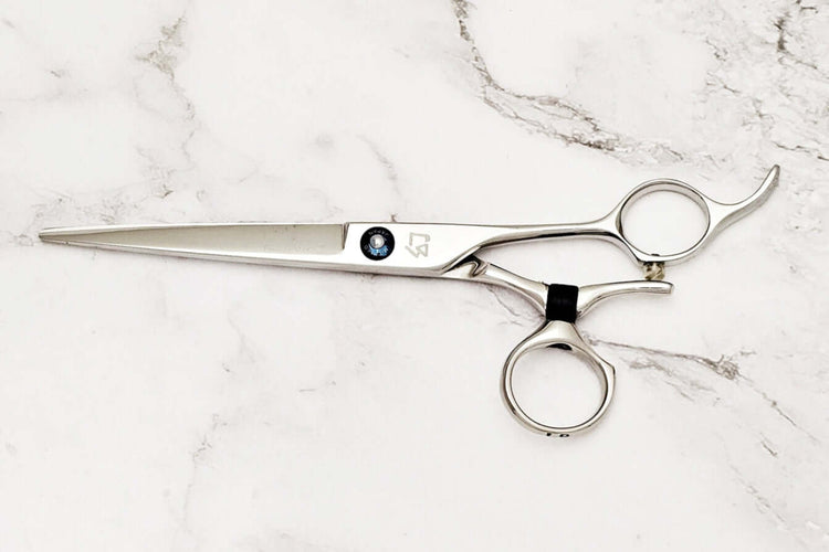 Swivel hair cutting scissors on a white background