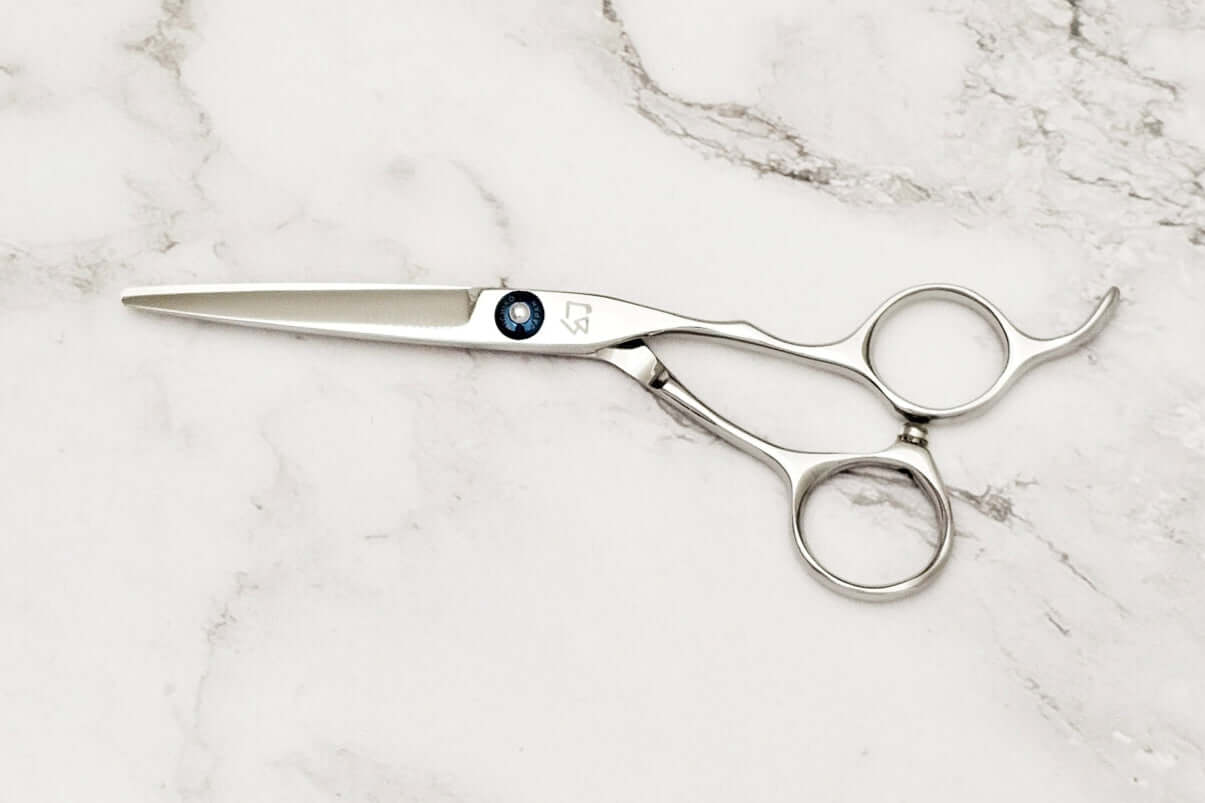 Hair scissors on a marble surface