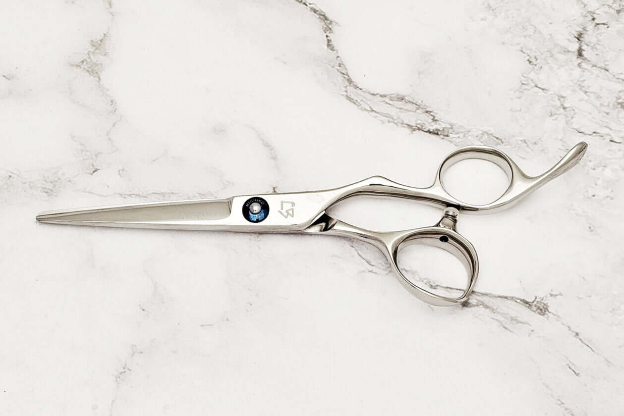 Hair scissors on a marble surface