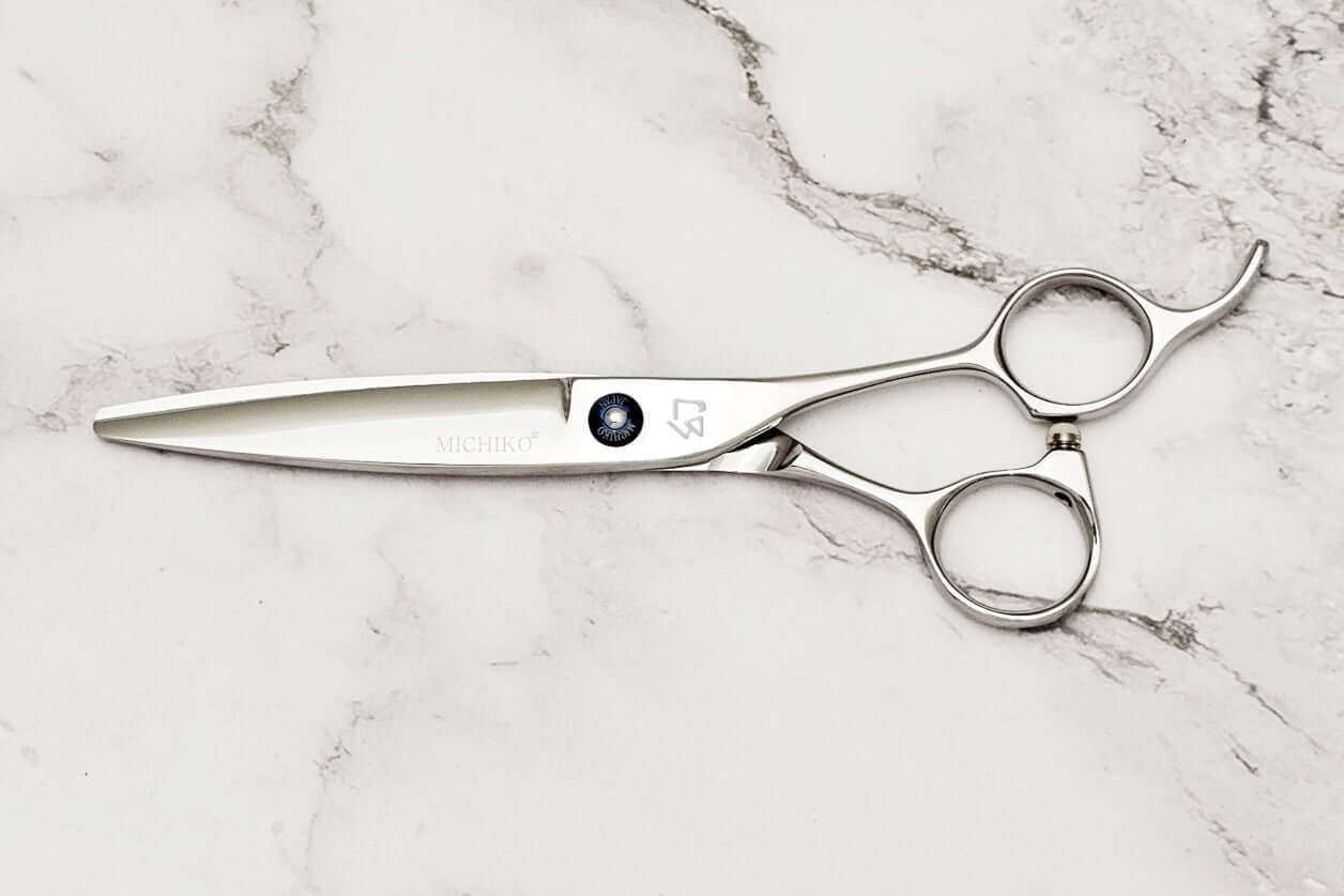 Hair scissors on a marble surface