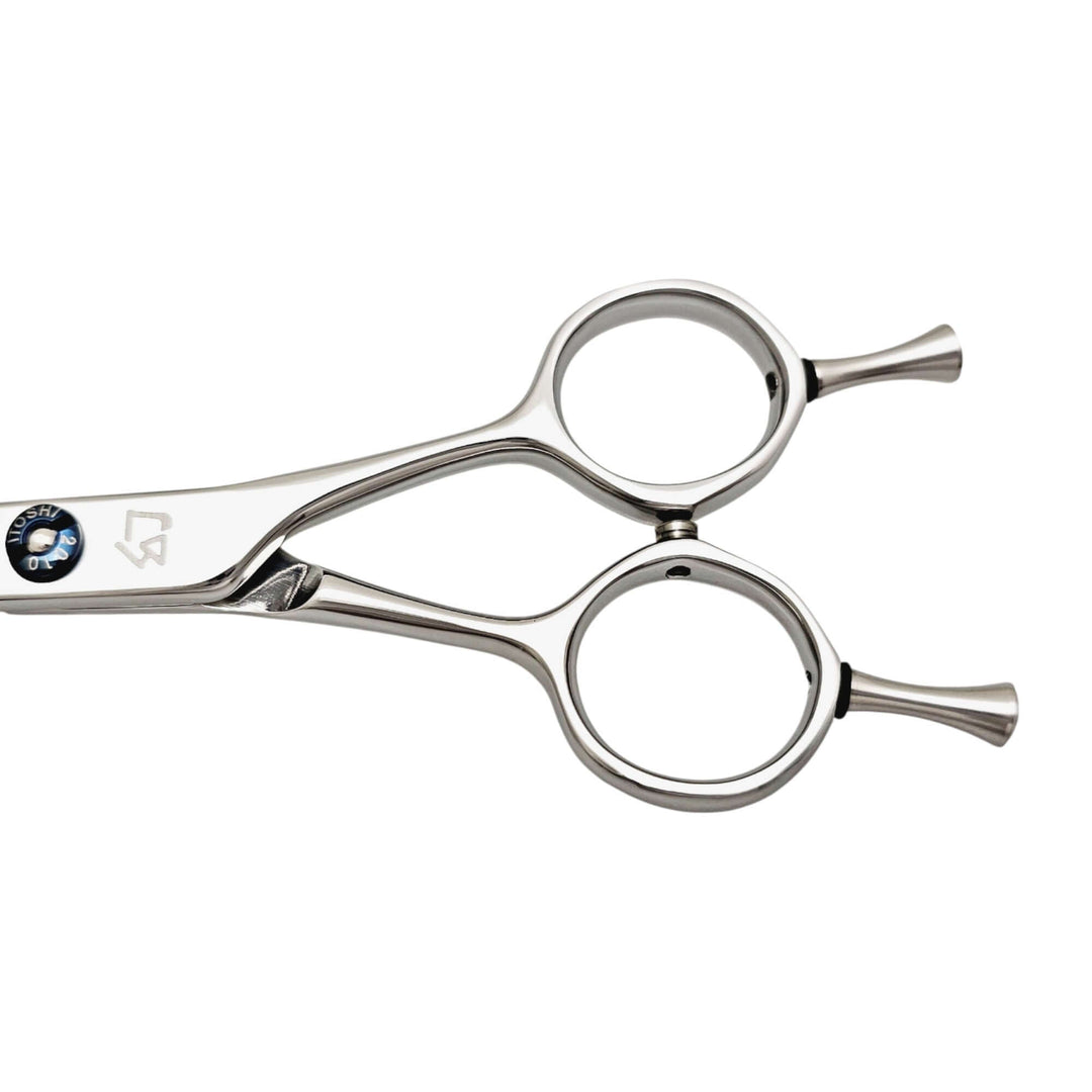 Close-up of hair cutting shears handle on a white background