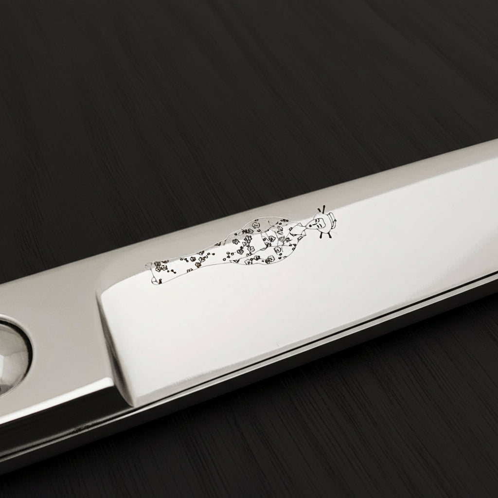 Metal hair scissors blade with Japanese lady wearing kimono design on a white background
