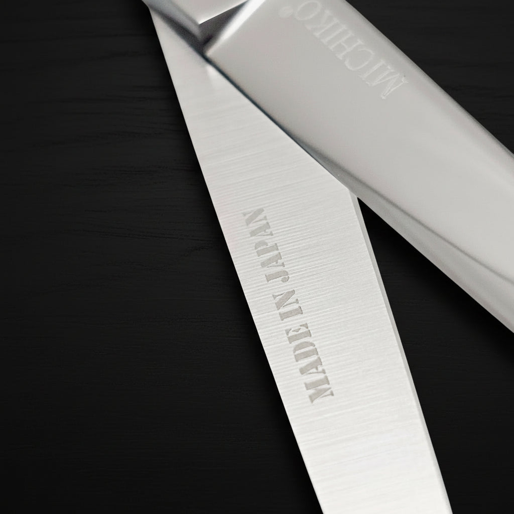 Professional Japanese Barber Shears with engraved 'Made in Japan' on the cutting blade.