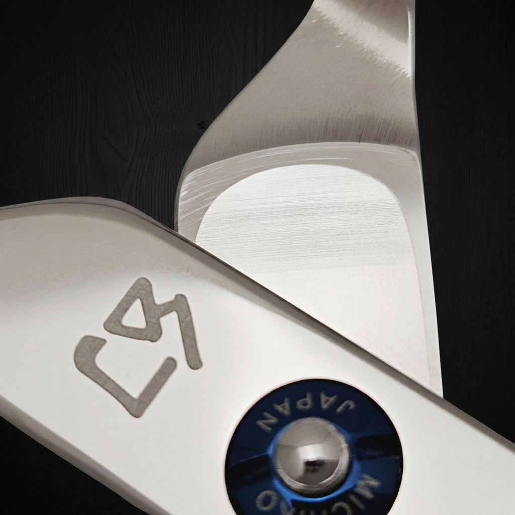 Close-up of a pair of hair shears with 'Japan' and 'Michiko' branding on a white background