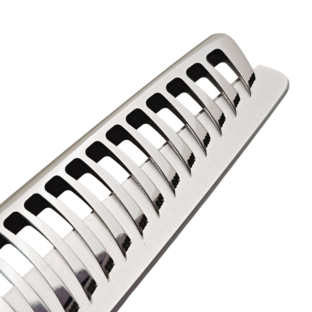 Close-up of hair thinning shears teeth on a white background