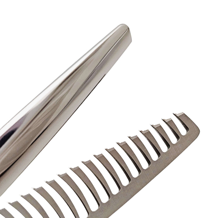 Close-up of hair thinning shears on a white background
