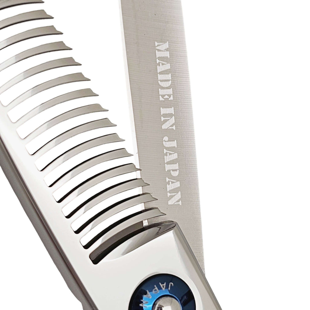 Metallic comb part of hair thinning shears with 'Made in Japan' text on a white background