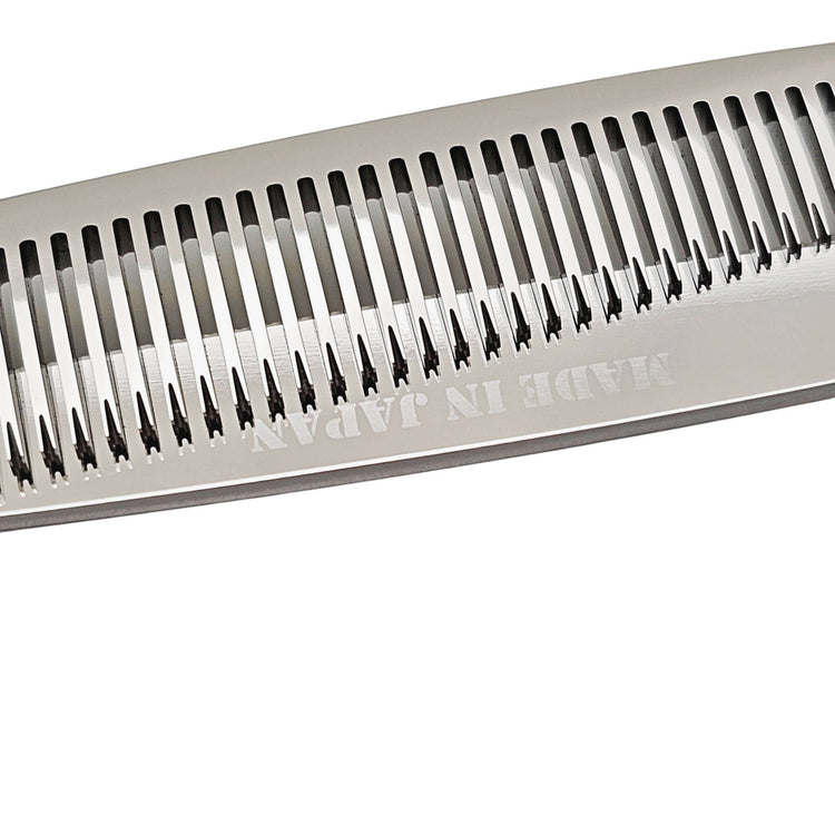Close-up of thinning blade of hair shears with 'Made in Japan' text on a white background