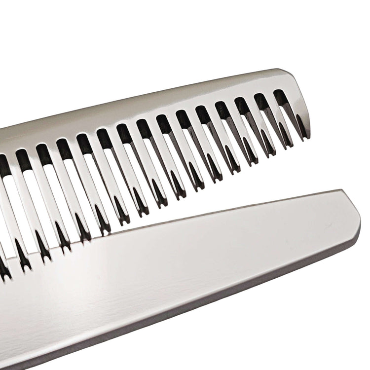 Close-up of hair thinning blade on a white background